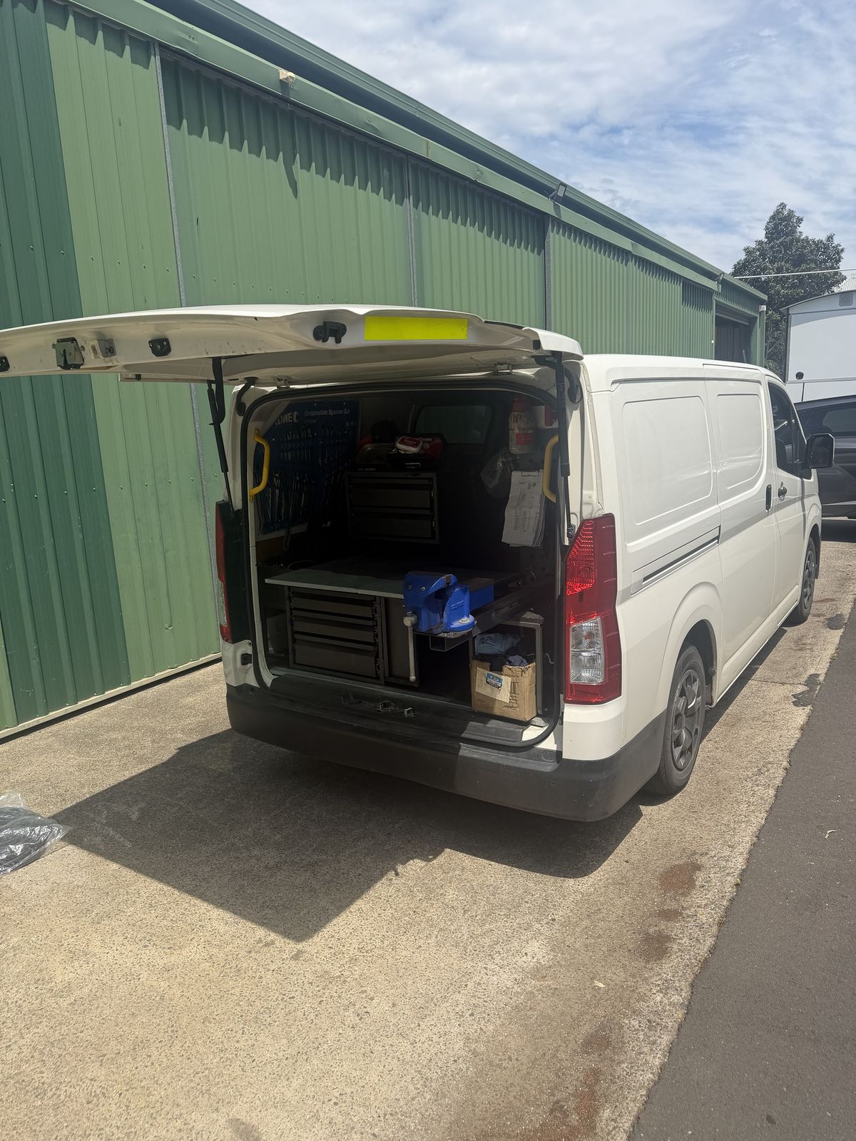 Power On service van with the rear open, fitted out with drawers, bench and vice